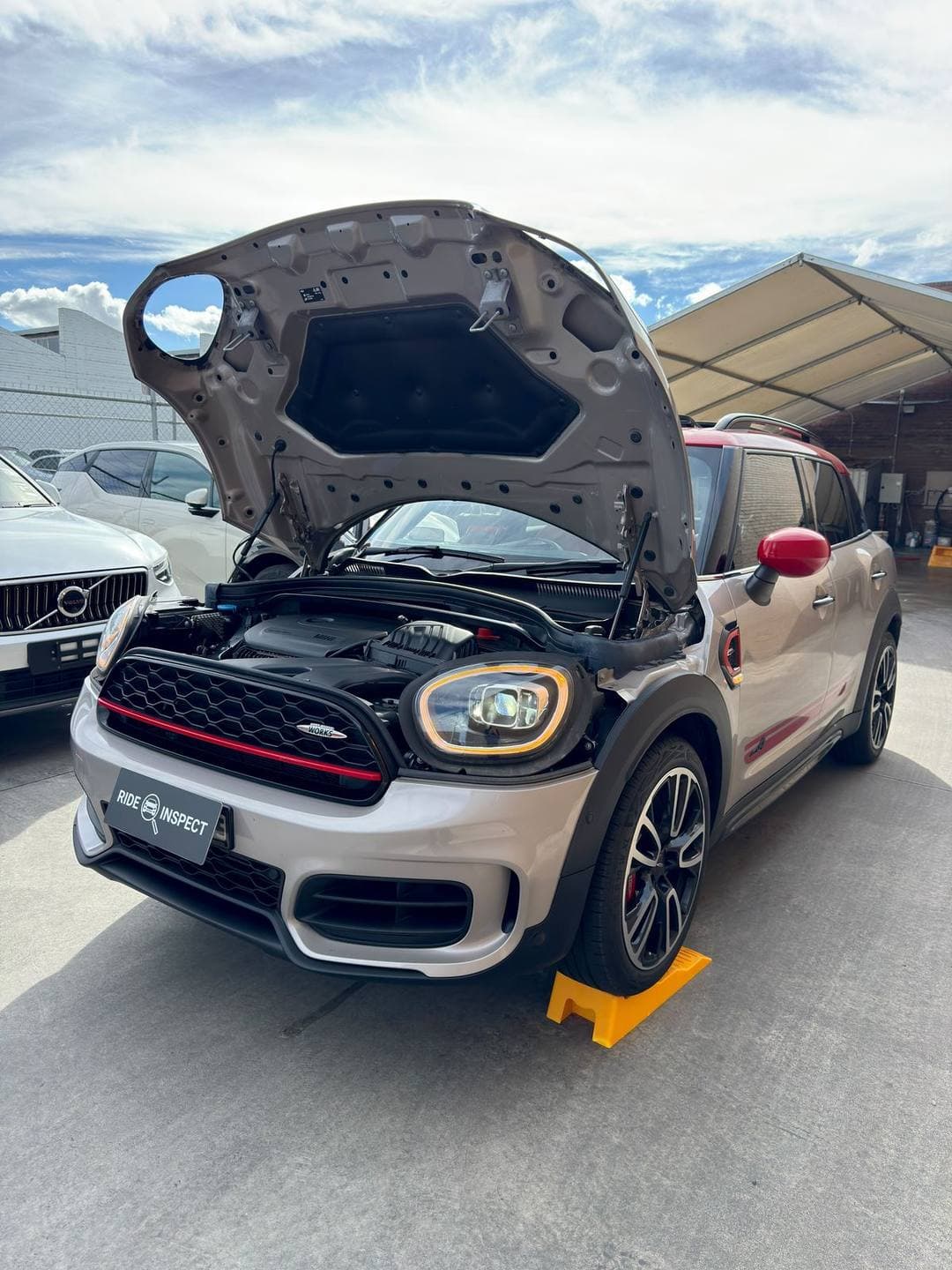 Silver MINI Countryman John Cooper Works with the bonnet up and a Ride Inspect plate cover